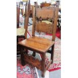 A set of four 17th century and later Italian walnut dining chairs on block supports.