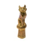 A continental bronze Art Deco desk seal modelled and cast as a seated wolf atop a canted tapering