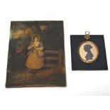 An oval silhouette portrait of a lady, displayed in a black papier mache rectangular frame and a