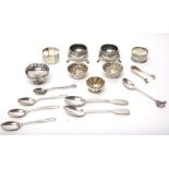 Mostly silver, comprising; a pair of Victorian circular salts, each raised on three feet, London