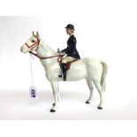 A Beswick huntswoman on a grey horse, No.1730, black printed mark.