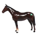 A Beswick shire horse (matt finish), two Beswick brown gloss horses and a Beswick brown gloss foal