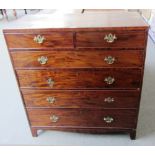 A George III mahogany chest of two short and four long graduated drawers on bracket feet, 107cm