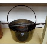 Nine copper graduated saucepans with cast iron handles, 19th century, and two brass jam pans with