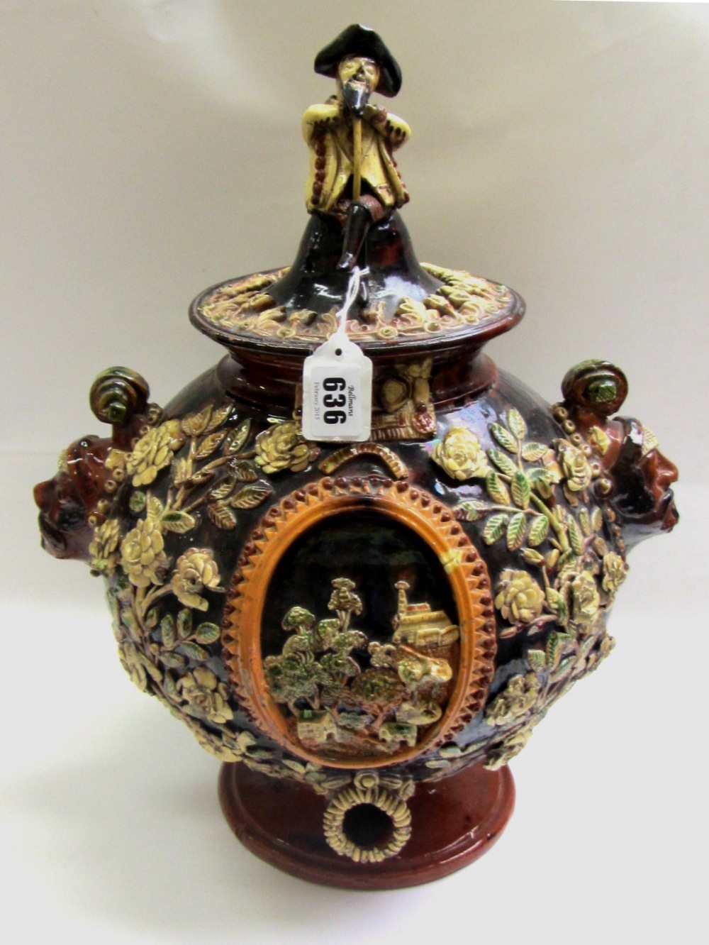 A Swiss pottery oviform cistern and cover, early 19th century, makers mark 'AO', with twin male