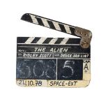 'The Alien', a vintage production used clapper board with painted white block lettering; 'The