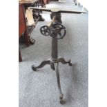 A cast iron artist's adjustable drafting table from the studio of Franklin Watkins, on tripod base