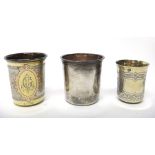 A European parcel gilt beaker, with engraved decoration, detailed 800, a Russian beaker, with