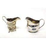 A silver helmet shaped milk jug, of plain form, circa 1800 and a silver helmet shaped cream jug,