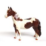 A Beswick skewbald pinto pony No.1373 and a piebald pinto pony No.1373, black printed marks (2).