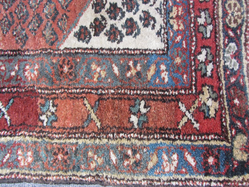 A Bidjar rug, Persian, the madder field with an allover herati design, ivory spandrels, three - Image 3 of 7