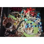 A quantity of assorted costume jewellery, including vintage items and a quantity of display stands.