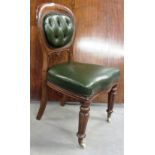 A set of eight Victorian oak and green leathered upholstered dining chairs with oval buttoned backs