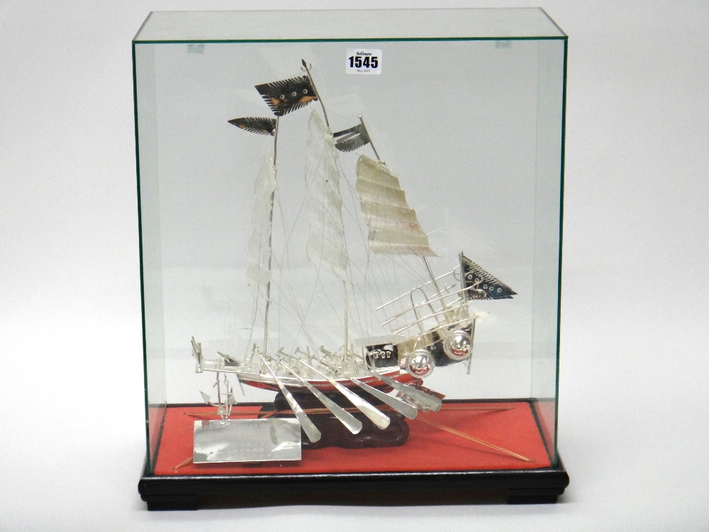 A Chinese white metal model of a junk,