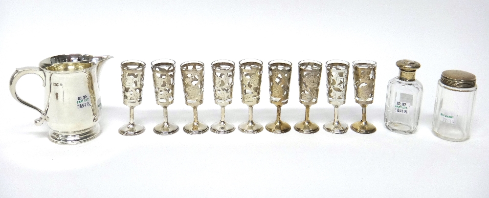 A set of nine Mexican Sterling mounted liqueur tots, a baluster shaped jug,