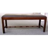 A mid 18th century style mahogany rectory stool with pierced stretcher, 122cm long.