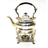 A silver spirit kettle, of compressed form, decorated with a gadrooned rim, having black fittings,