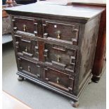 A Charles II oak geometric moulded chest of three long drawers, on bun feet, 97cm wide.