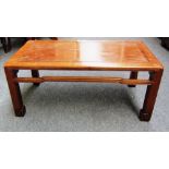 An early 20th century Chinese hardwood low rectangular table on block supports, 75cm wide.