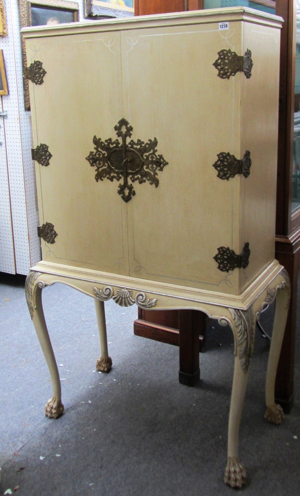 An early 20th century gilt metal mounted cream painted two door drinks cabinet on hairy lions paw - Image 2 of 2
