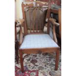 A George III mahogany Gothic revival carver chair on canted square supports,