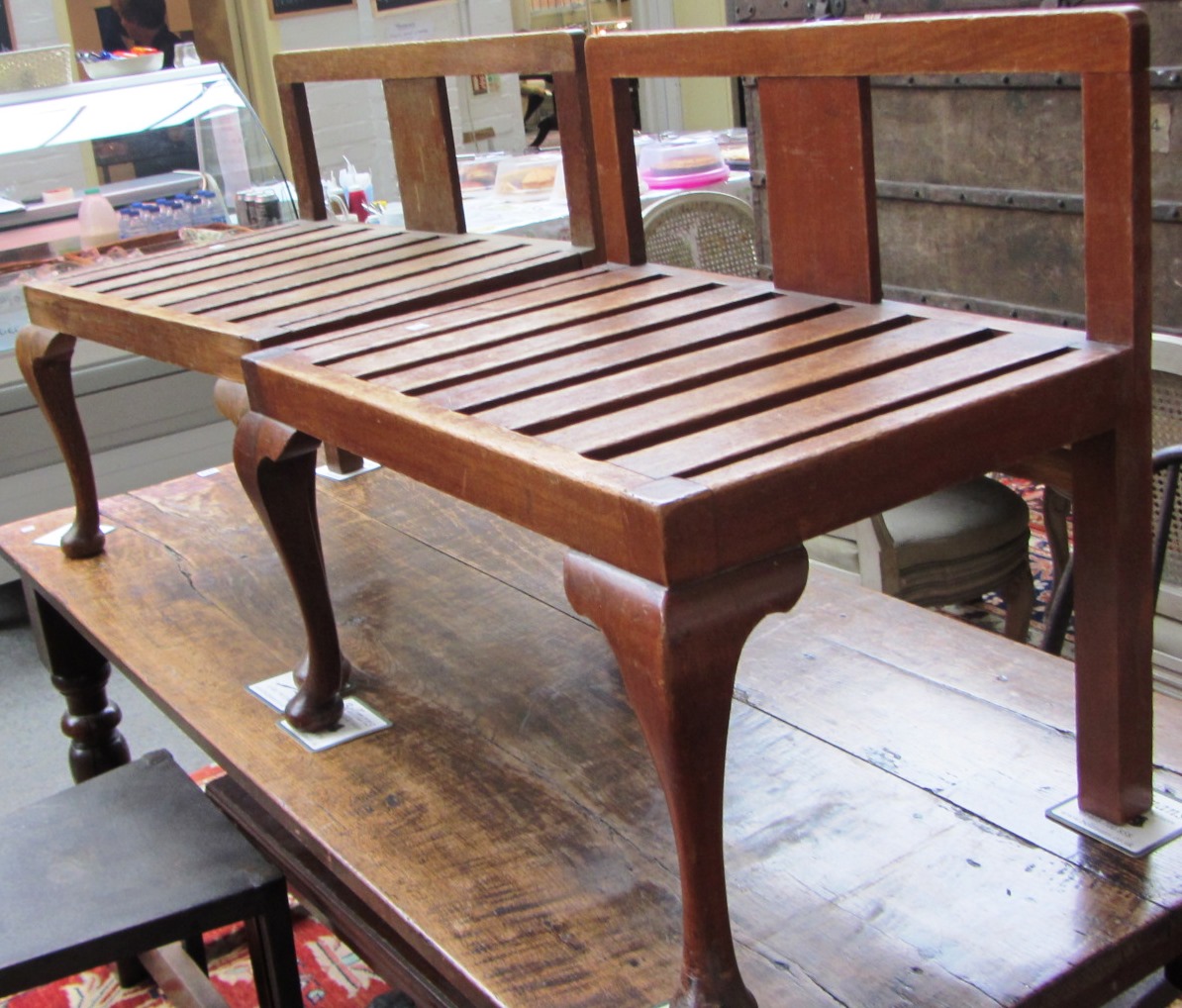 A pair of 20th century oak luggage stands on cabriole supports,