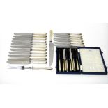 Eight silver handled tea knives, with steel blades, with an associated case to hold six tea knives,