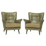 A pair of mid 20th century green leather upholstered easy armchairs on turned supports.