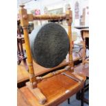 A Victorian oak gong stand on a square and turned frame with sledge feet, 63cm wide.