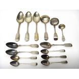 Silver fiddle pattern table flatware, comprising; a sugar sifting spoon, Exeter 1866, a sauce ladle,