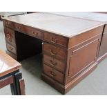 An 18th century style mahogany partners desk with nine drawers and opposing cupboards, 152cm wide.