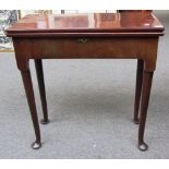 A George II mahogany tea table on turned supports and pad feet, 71cm wide.