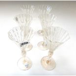 A set of six latticino wine glasses, late 19th century, each with an octagonal funnel bowl,