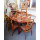 A mid 20th century oval extending dining table on tapering supports, to include two extra leaves,