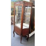 An early 20th century French gilt metal mounted parquetry inlaid mahogany marble top vitrine,
