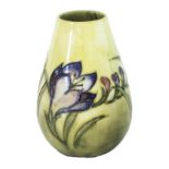 A Moorcroft pottery vase, early/mid 20th century, decorated with 'Freisa' against a yellow ground,