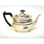 A late Victorian silver teapot, of shaped oval form,