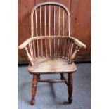 A child's ash and elm stick back Windsor chair on turned supports, 80cm high.