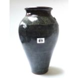 A studio pottery vase by Jennie Gilbert decorated with a geometric band to the shoulder, 33cm high,