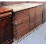 A large 19th century brass bound oak trunk with side carry handles, 150cm wide.