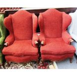 A pair of Louis XV style wingback armchairs on floral carved mahogany supports.