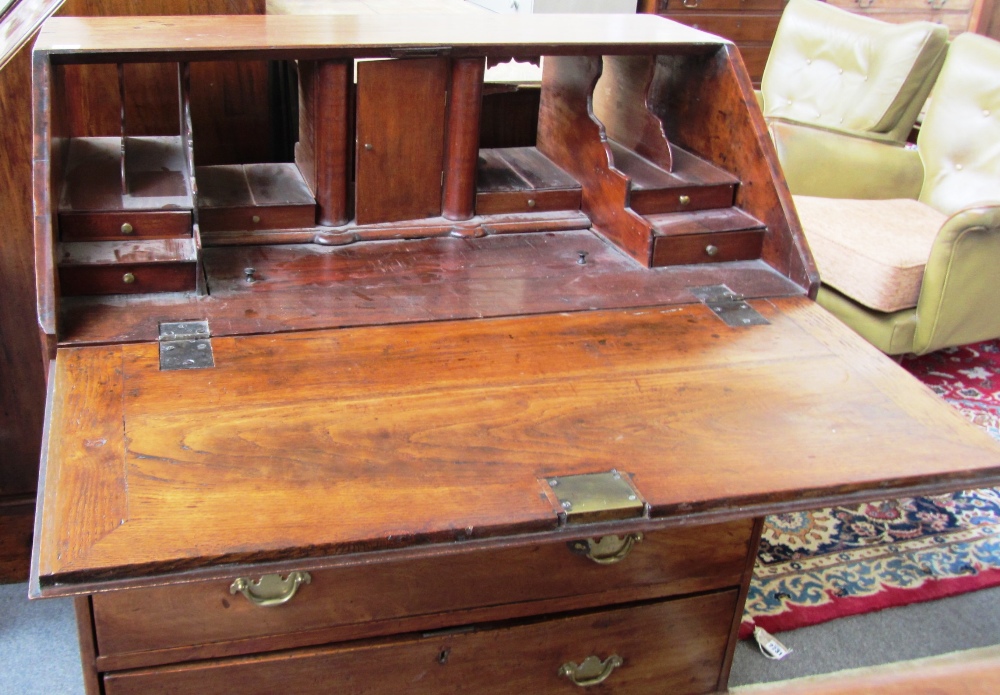 A George III fruitwood bureau, the fitted interior over two short and two long graduated drawers, - Image 2 of 2