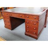 A 19th century mahogany pedestal desk with nine drawers about the knee, 152cm wide.