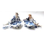 A pair of Meissen blue and white figural salts, late 19th century,