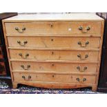 An early 19th century pine chest with five long drawers on bracket feet, 92cm wide.