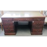 An 18th century style mahogany pedestal desk with nine frieze drawers, 151cm wide.