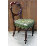 A set of six Victorian mahogany balloon back dining chairs on reeded supports.