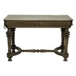 A 19th century later stripped oak rectangular centre table with lions head mounts,