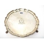 A silver salver, Birmingham 1988, shaped circular with moulded edge on three leaf scroll feet,