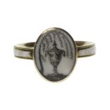 A George III gold and white enamelled mourning ring,